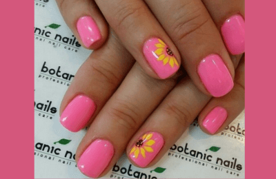 35+ Pink Summer Nails ideas for Trendy style in 2025 7 Pink summer nails featuring a vibrant sunflower design with a hot pink ombre effect.