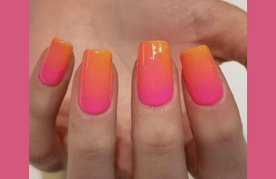 35+ Pink Summer Nails ideas for Trendy style in 2025 9 Vibrant orange and hot pink ombre design on pink summer nails, perfect for summer vibes.