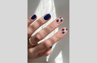40 Navy Blue Nail Designs to Elevate Your Style 2025 10 Navy Blue nails with daisy floral nail art
