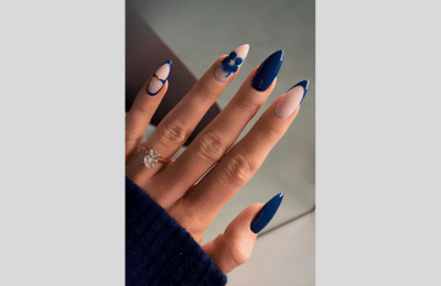 40 Navy Blue Nail Designs to Elevate Your Style 2025 2 blooming flowers with Navy Blue Nail designs
