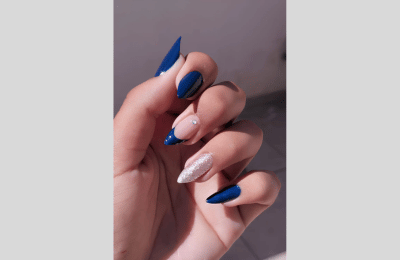 40 Navy Blue Nail Designs to Elevate Your Style 2025 8 Navy blue nail with glitter and gems designs