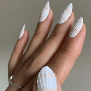 Beachy white summer nails with seashell-inspired nail art