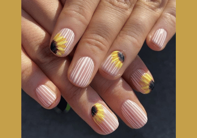 Vertical striped nails with sunflower stickers for style