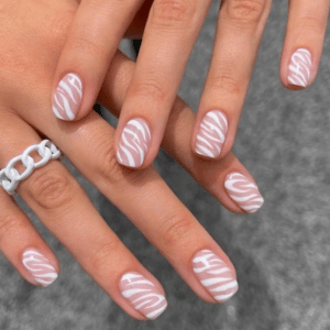 White and silver zebra-striped nails for a wild summer look