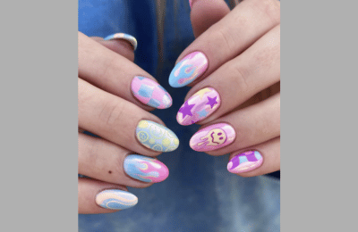 Nails with smiley faces and flame designs for an edgy look