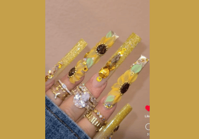 Acrylic sunflower nails with bling for classy elegant look