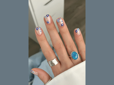 50 Stunning Short Spring Nail Designs Trending in 2025 35 sheer white nail art with beautiful blue flowers