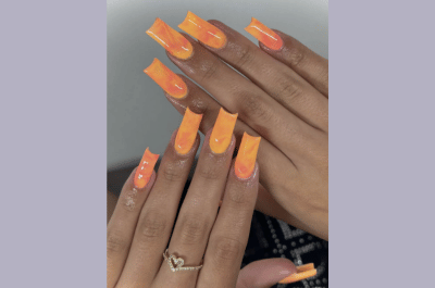 Sunset gradient marble nails in yellow and orange.