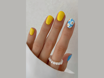 50 Stunning Short Spring Nail Designs Trending in 2025 6 Short spring nails combining yellow and blue for a lively, playful look.