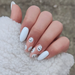 Fun white summer nails with cute smiley face nail art