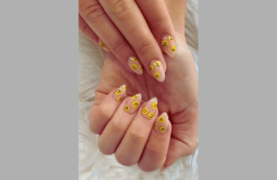 Transparent nails with colorful smiley speckles for a fun vibe