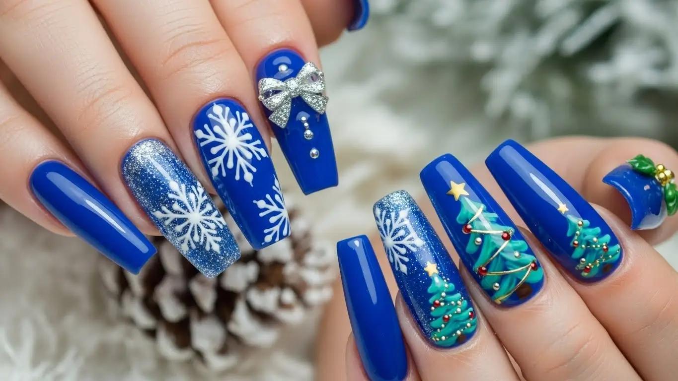Blue Christmas acrylic nails with 3D details and glitter, dramatic and eye-catching blue Christmas nail designs.