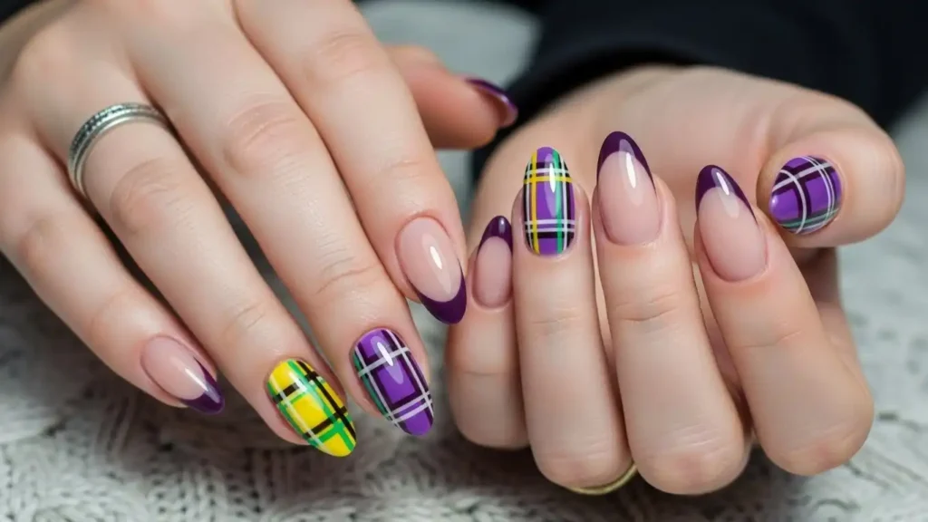 Festive winter plaid nail design with purple, green, and nude French tips.